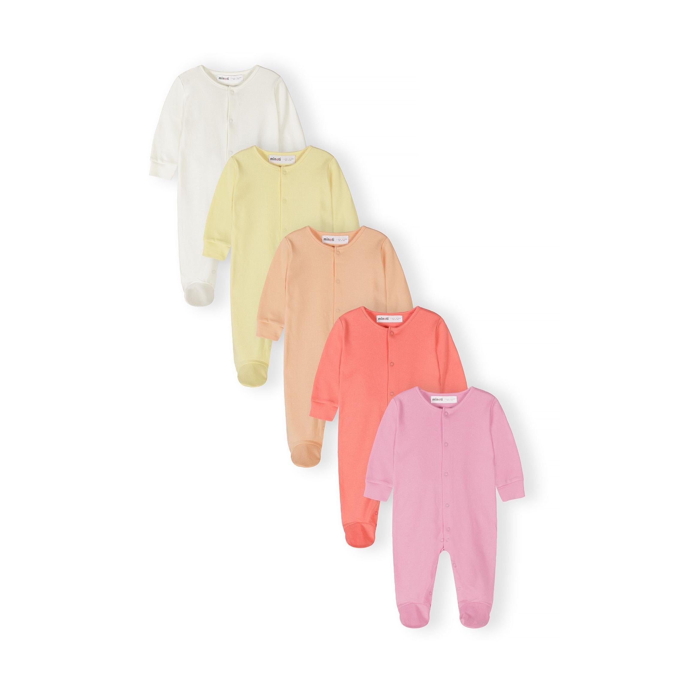 Five baby sleepsuits arranged in a fan pattern showing cream, yellow, peach, coral and pink colours with long sleeves and integrated feet on white background