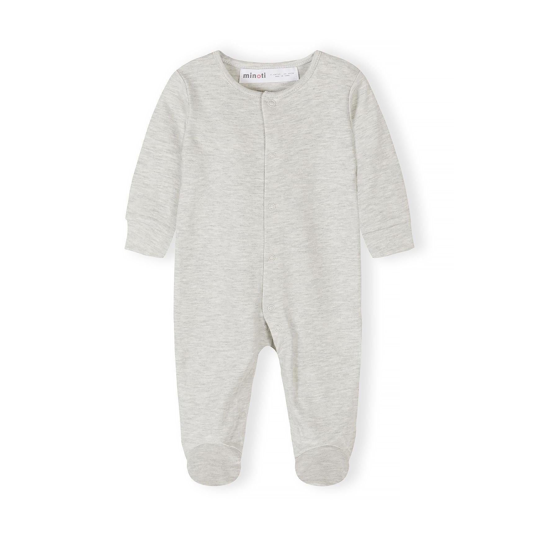Close-up detail of light blue sleepsuit showing Minoti label, snap button closure and ribbed collar construction