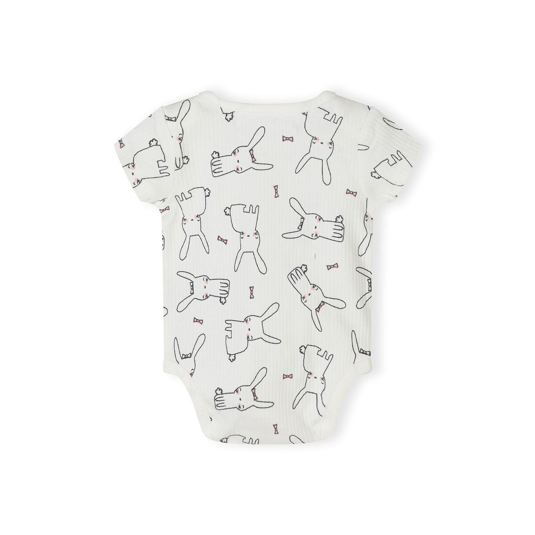 Close-up detail of white bodysuit showing Minoti label and cute rabbit illustrations with pink bow ties