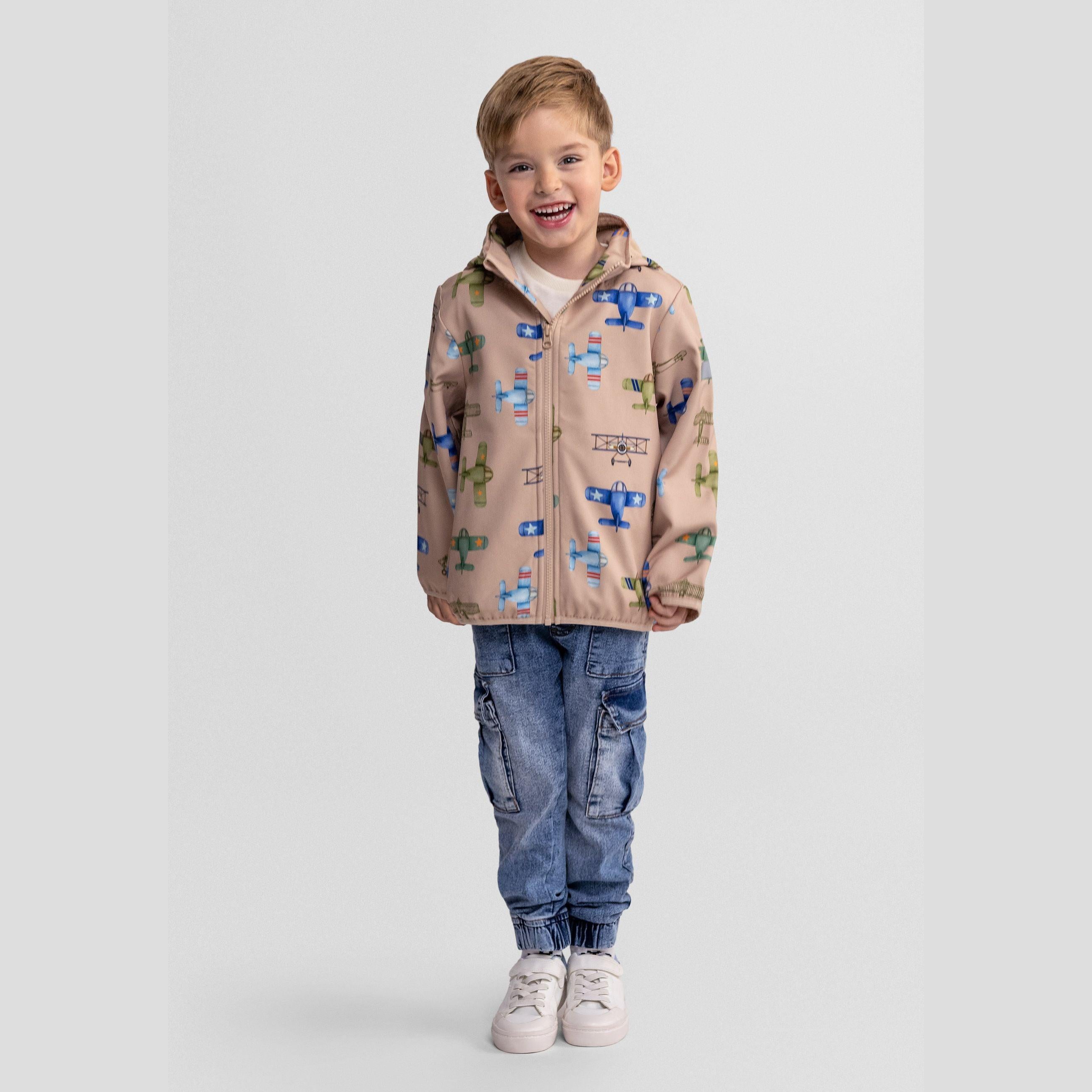 Back view of sand-coloured softshell jacket with colourful aeroplane print pattern showing various aircraft designs in blue, green and neutral tones against white background