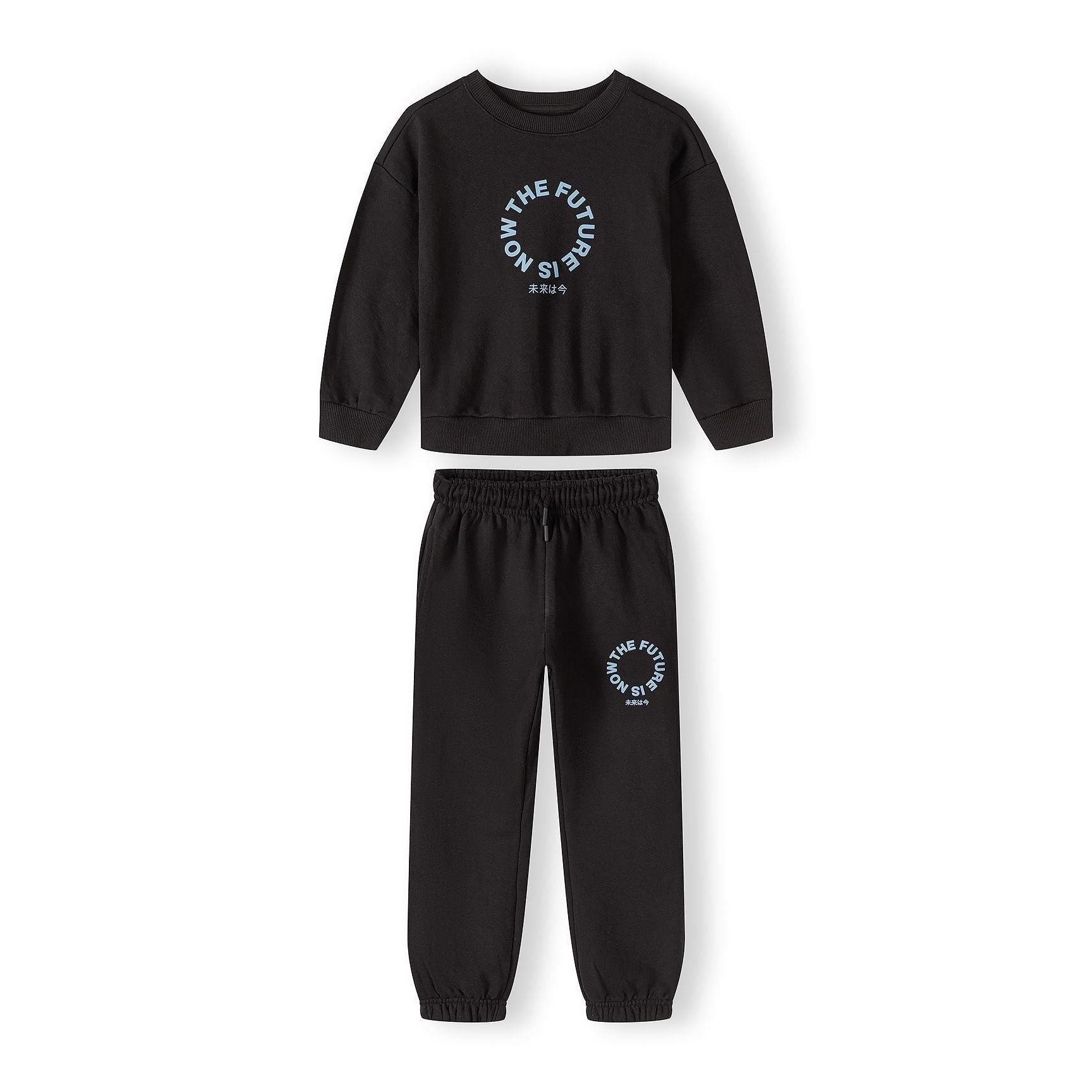 Black tracksuit set with printed sweatshirt and joggers displayed flat on white background, showing coordinated design with circular text print