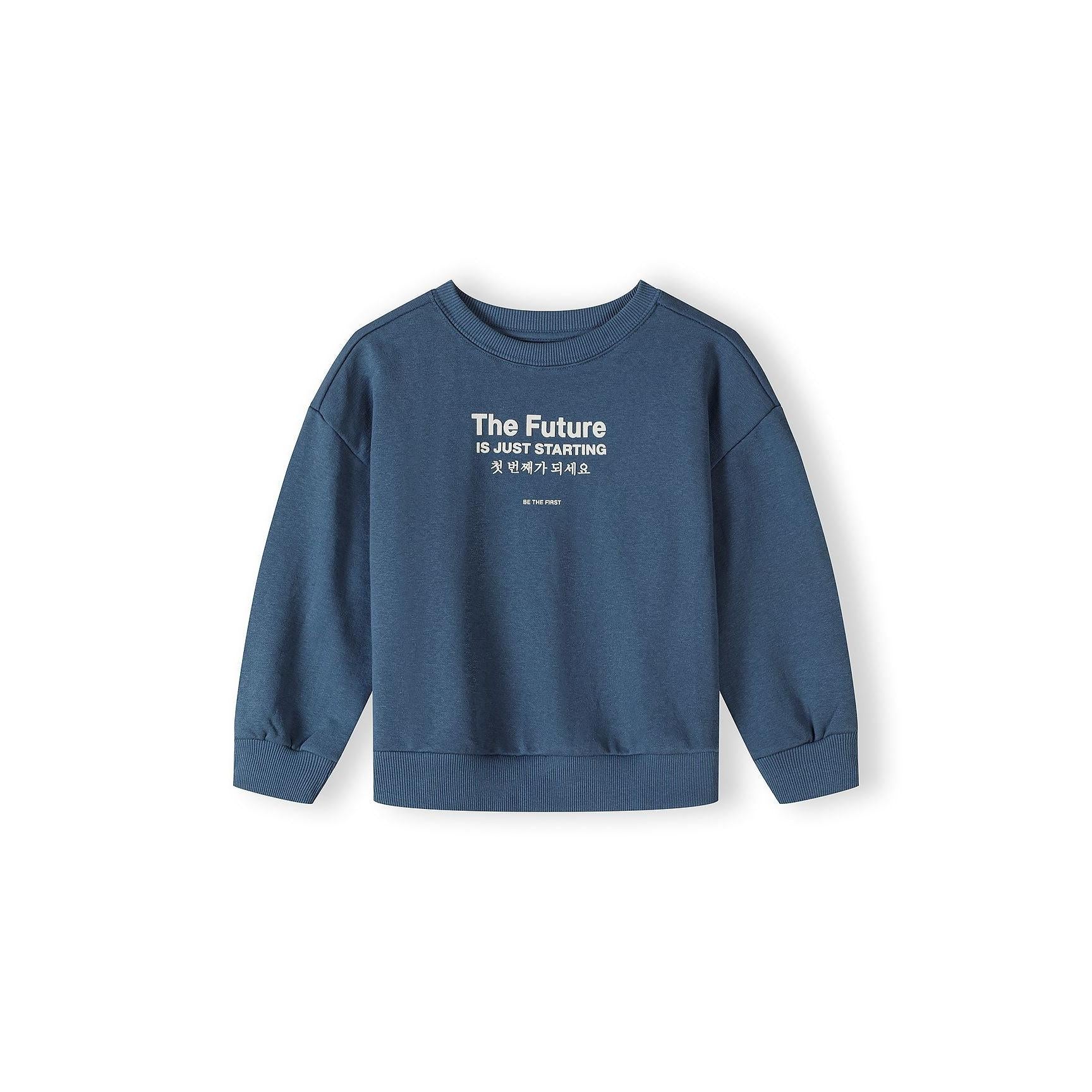 Close-up of blue joggers waistband showing elasticated waist with drawstring and matching text graphics