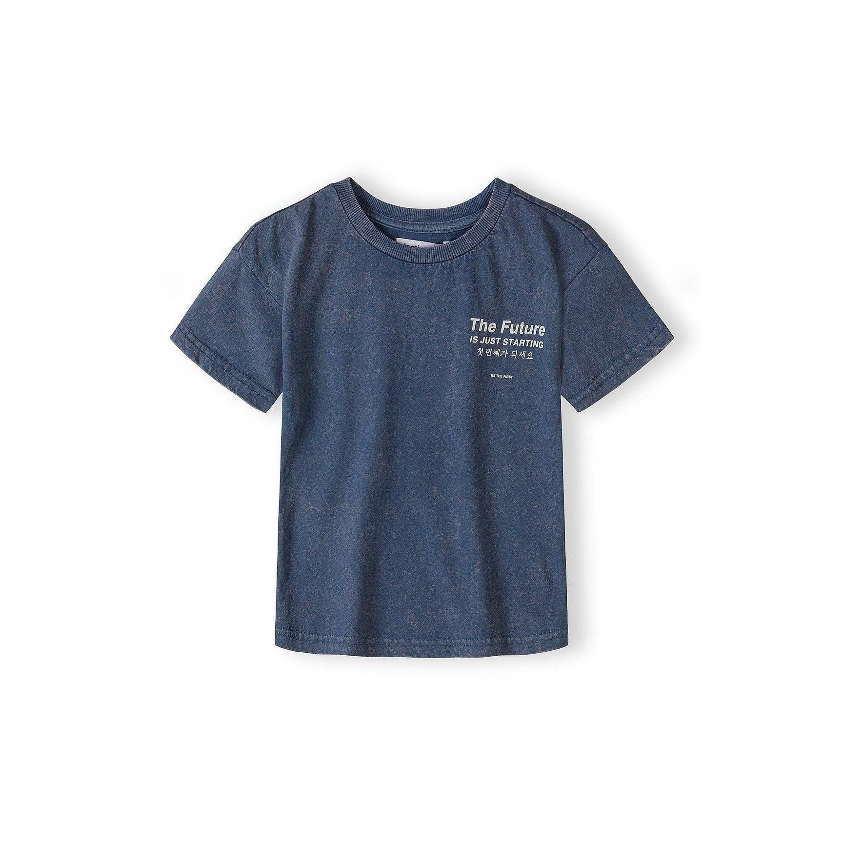 Close-up detail of blue acid wash shorts waistband showing Minoti label and 'The Future is Just Starting' text with Korean translation