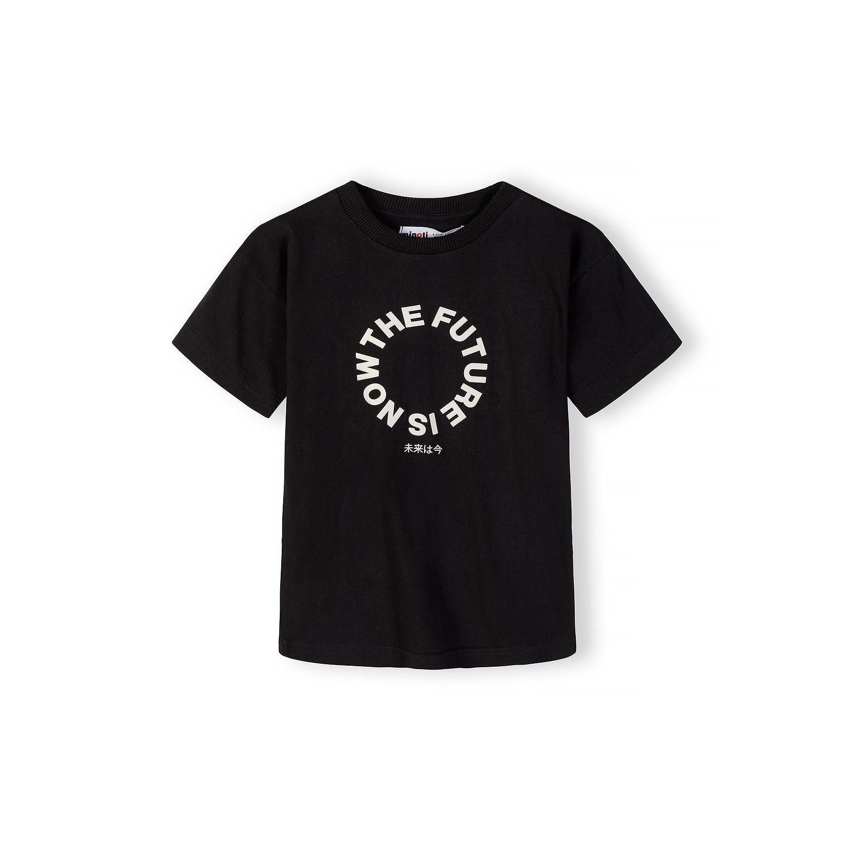 Close-up front view of black t-shirt showing detailed The Future is Now circular white text print with Japanese characters below