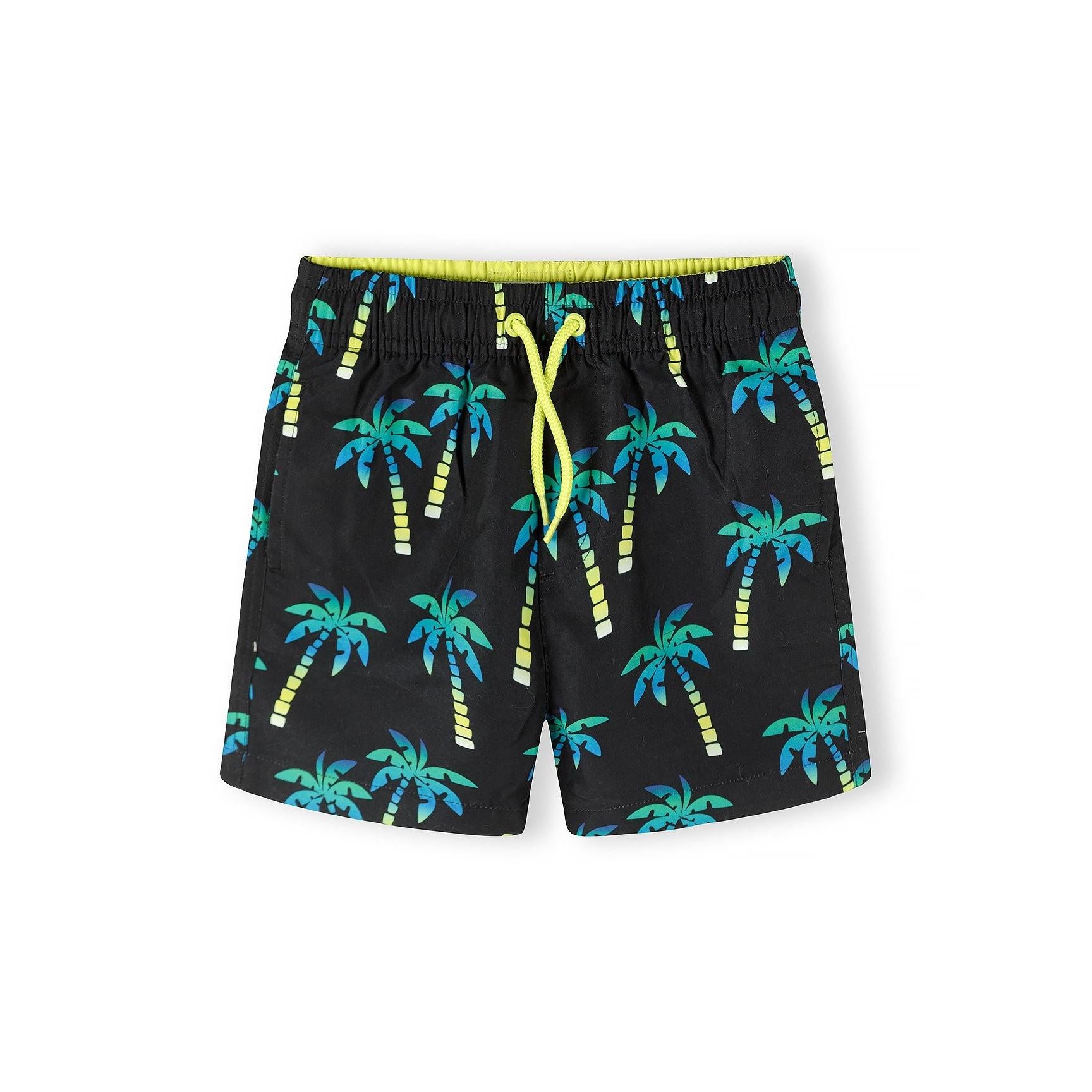 Black swimming shorts with tropical palm tree print pattern in teal and blue colours, featuring yellow drawstring waistband detail