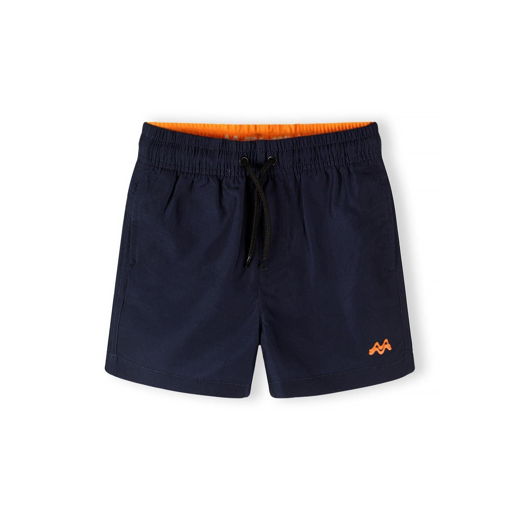Single navy blue swim shorts with orange contrast waistband lining and drawstring ties on white background