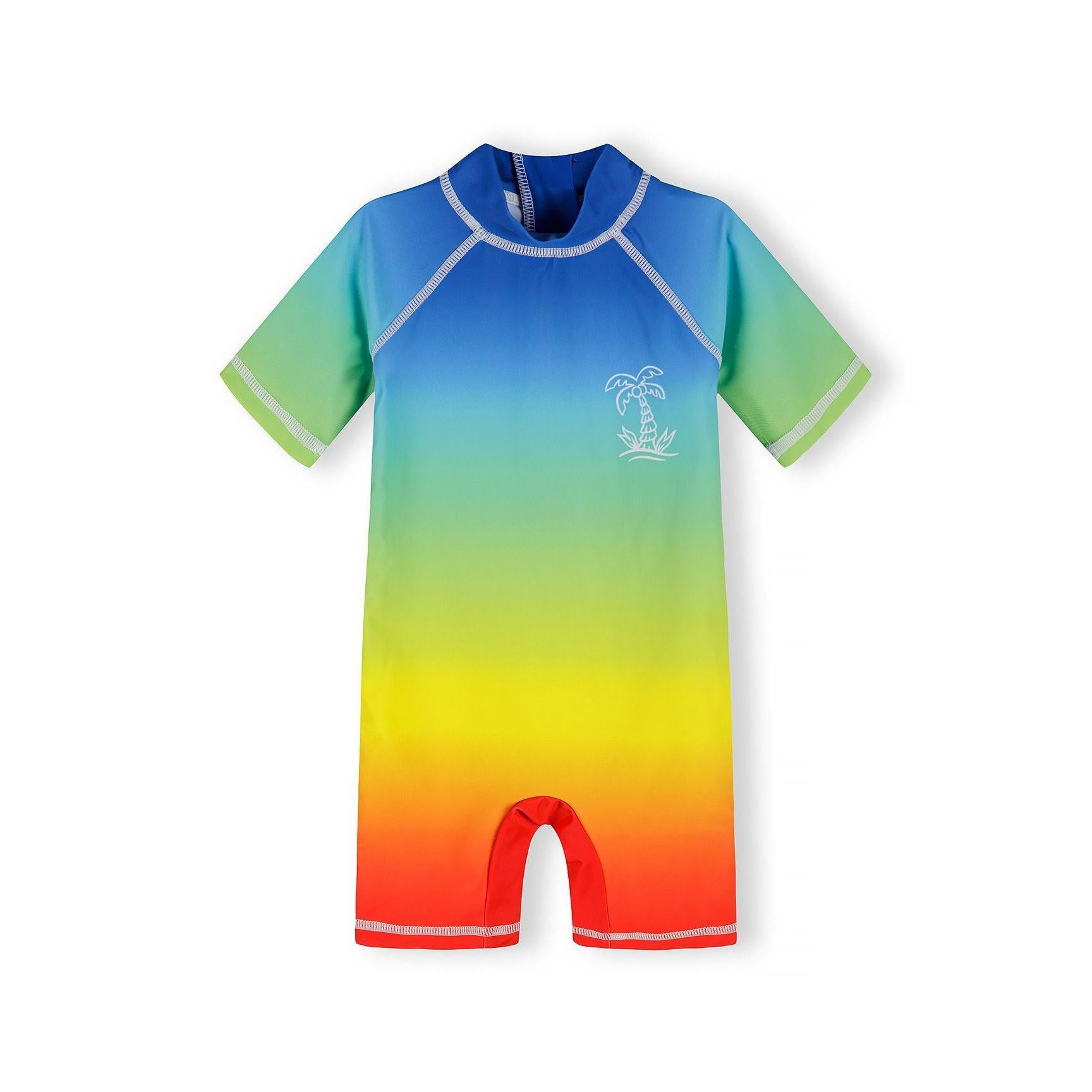 Royal blue to orange ombré rash suit with short sleeves and front zipper, featuring palm tree print on chest, displayed flat against white background
