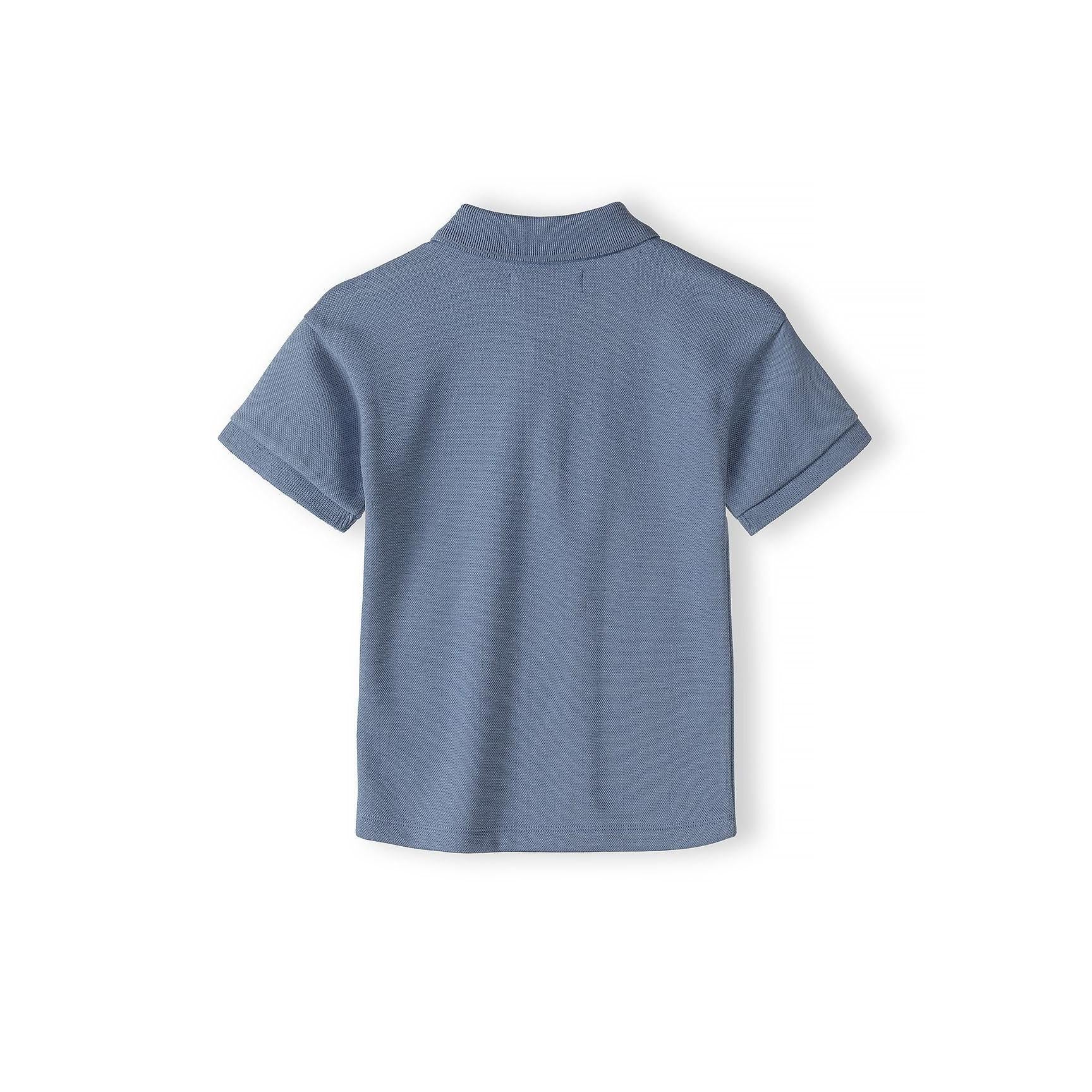 Back view of blue pique polo shirt laid flat showing classic collar and short sleeves on white background