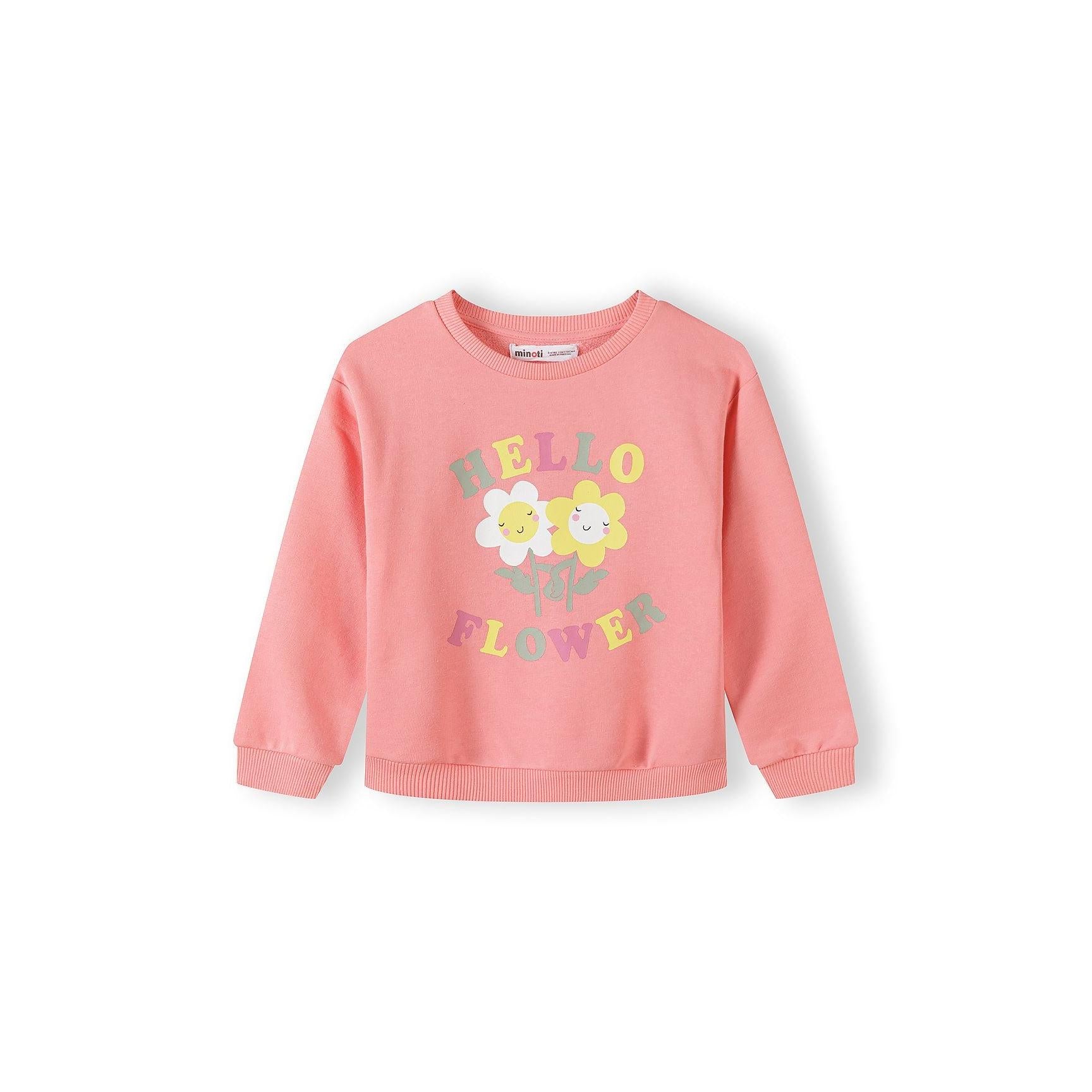 Close-up of bright pink sweatshirt with Cutesy Club text in yellow and green letters on white background