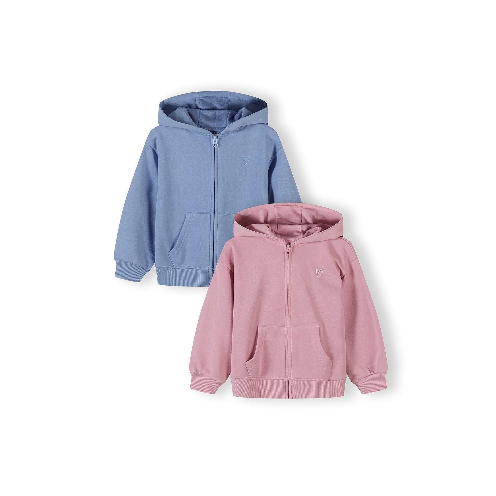 Two zip-front hoodies displayed on white background - one dusty blue hoodie positioned above and one dusty pink hoodie positioned below, both featuring kangaroo pockets and ribbed cuffs