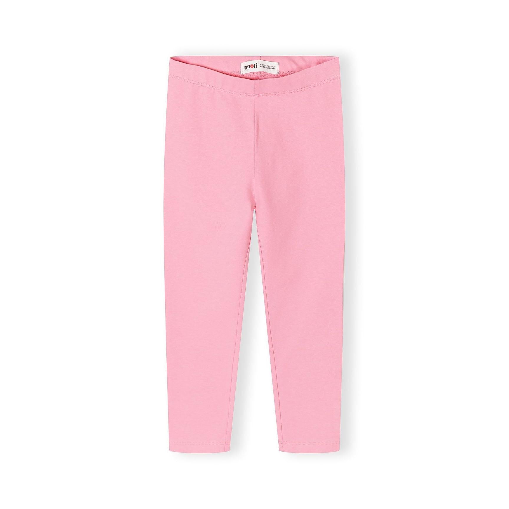 Close up detail of coral pink leggings showing soft fabric texture and comfortable elastic waistband construction