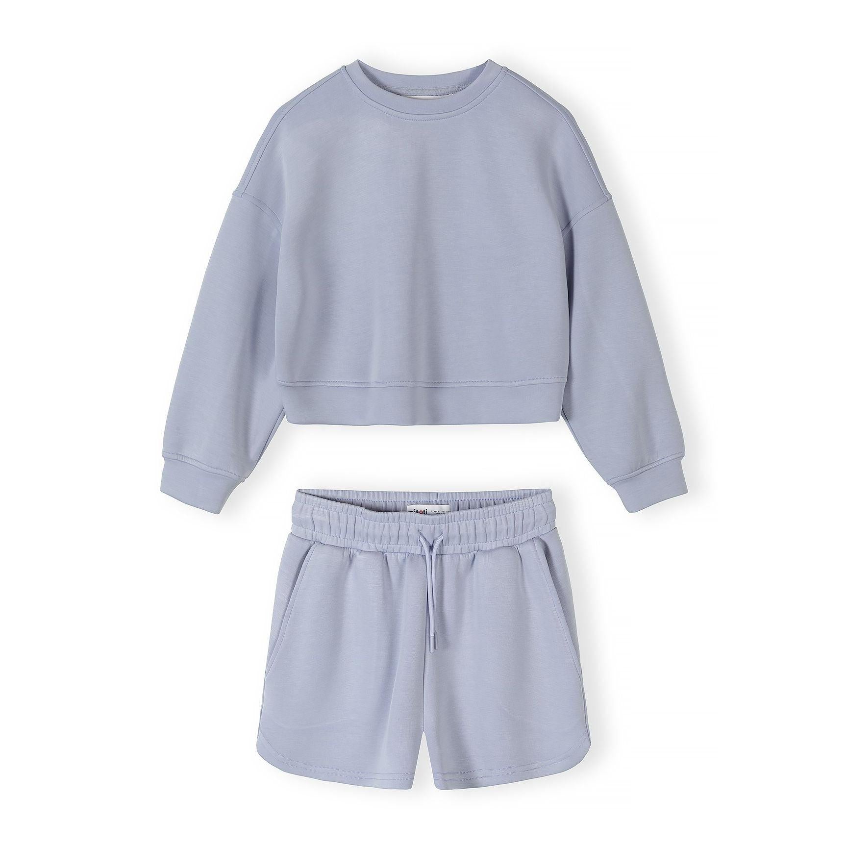 Close-up detail of lavender shorts showing elasticated waistband with drawstring ties