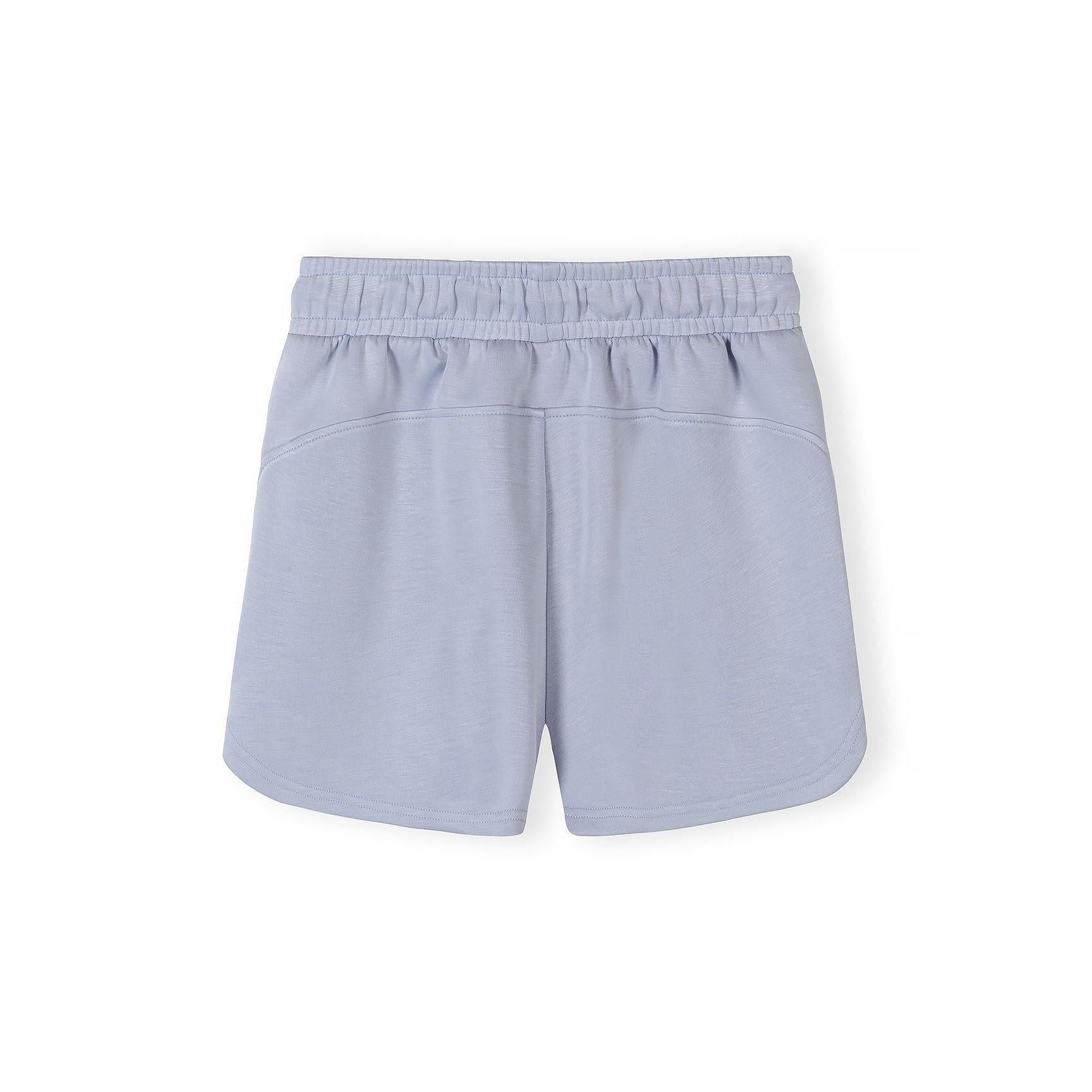 Close-up detail of lavender shorts showing elasticated waistband with drawstring ties