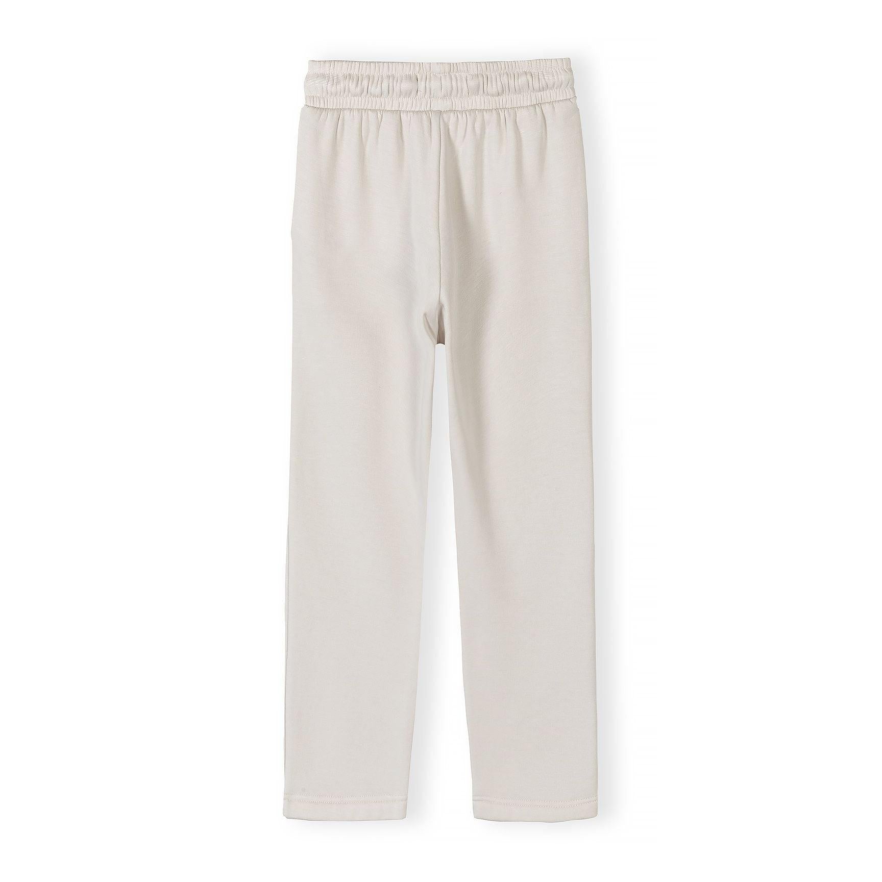 Flat lay of off-white wide leg joggers showing full length and silhouette on white background