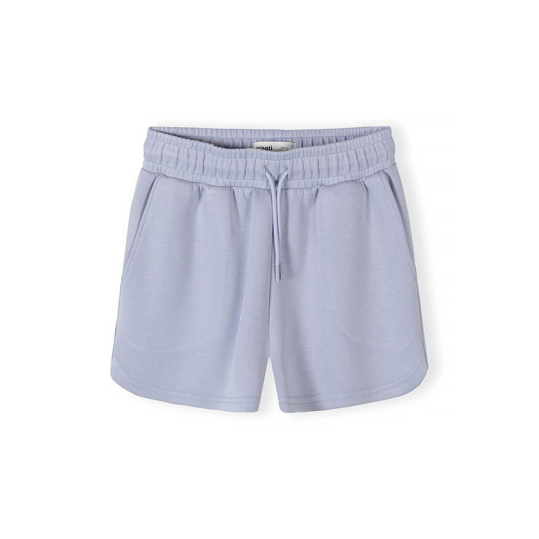 Close-up of lavender blue shorts with elastic waistband and drawstring detail on white background