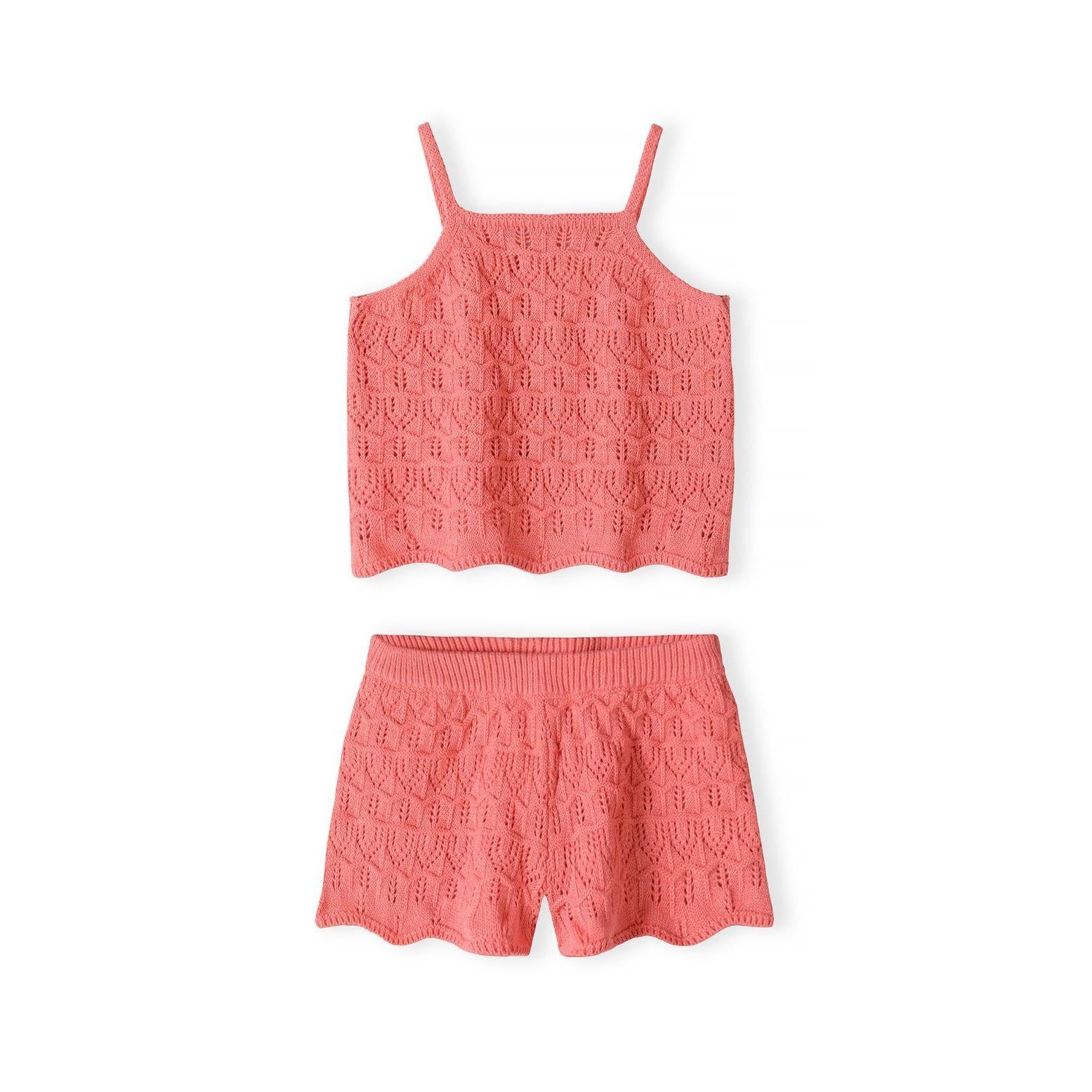 Coral pink crochet vest and shorts set displayed flat on white background showing intricate lace pattern detailing