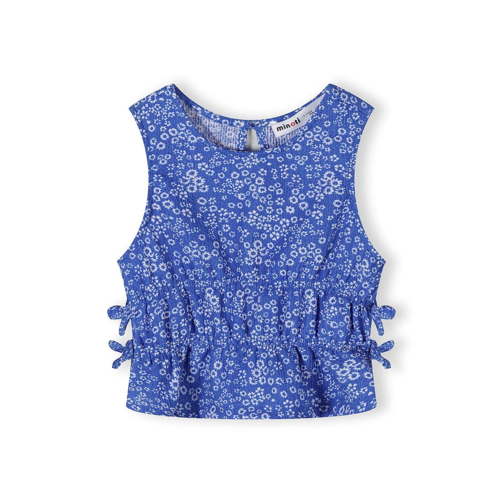 Wide-leg blue trousers with small white floral print displayed flat on white background, showing elastic waistband and relaxed fit