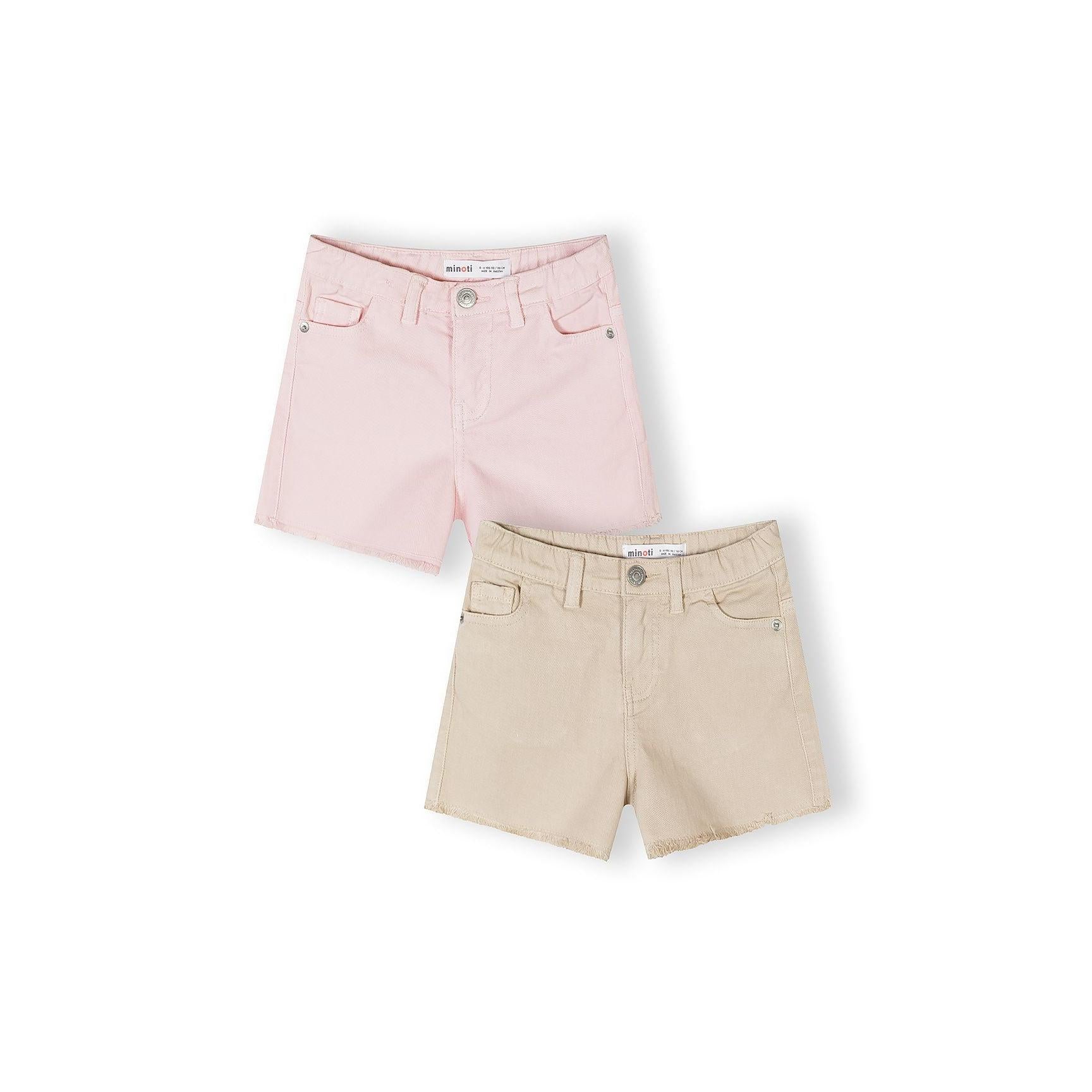Two cotton twill shorts laid flat on white background - pink pair on top, beige pair below, showing classic 5-pocket styling with button fastening and Minoti label