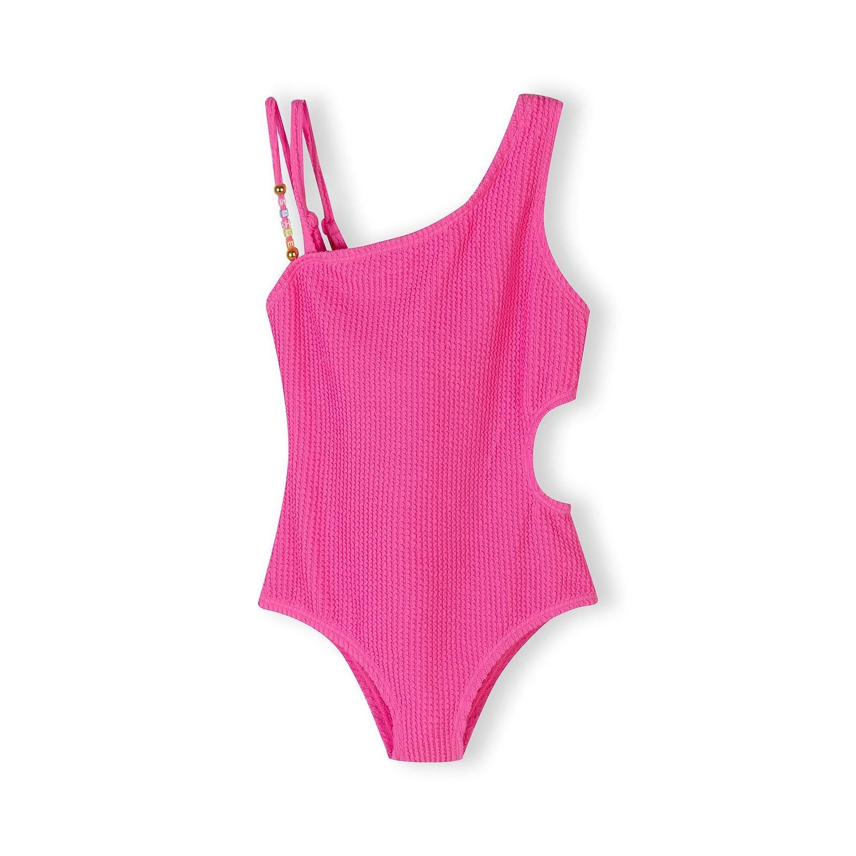 Bright pink asymmetrical swimsuit with cut-out waist detail and decorative beaded straps on white background