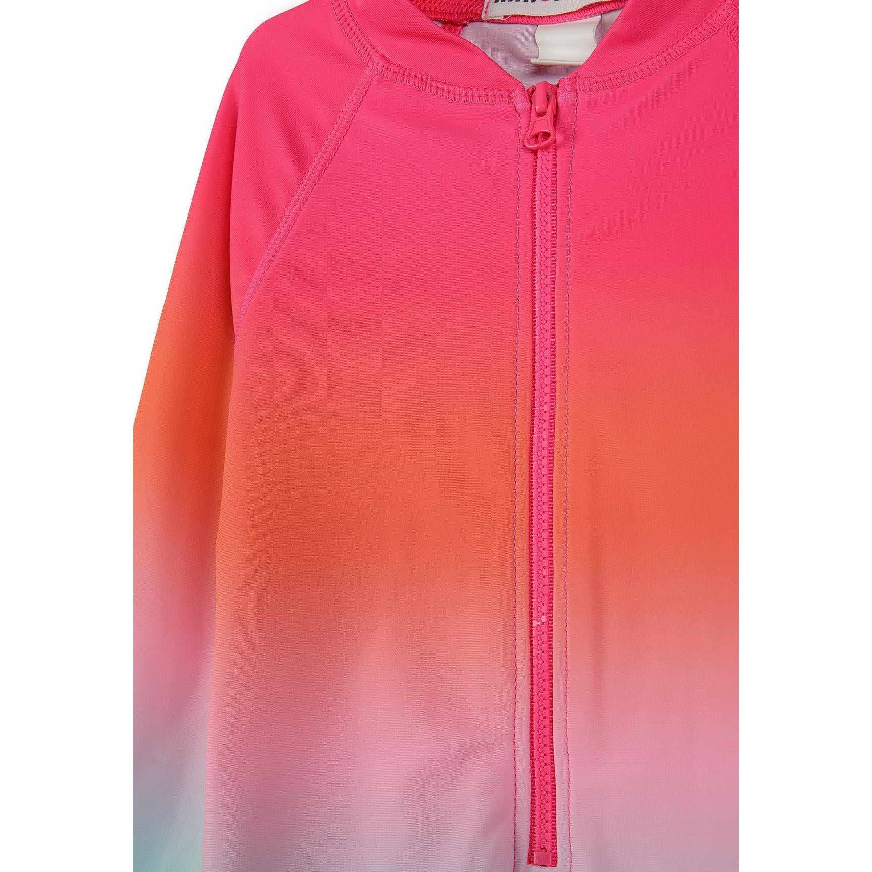 Close-up detail of pink zip front closure and ombre color gradient from pink to coral on swimsuit