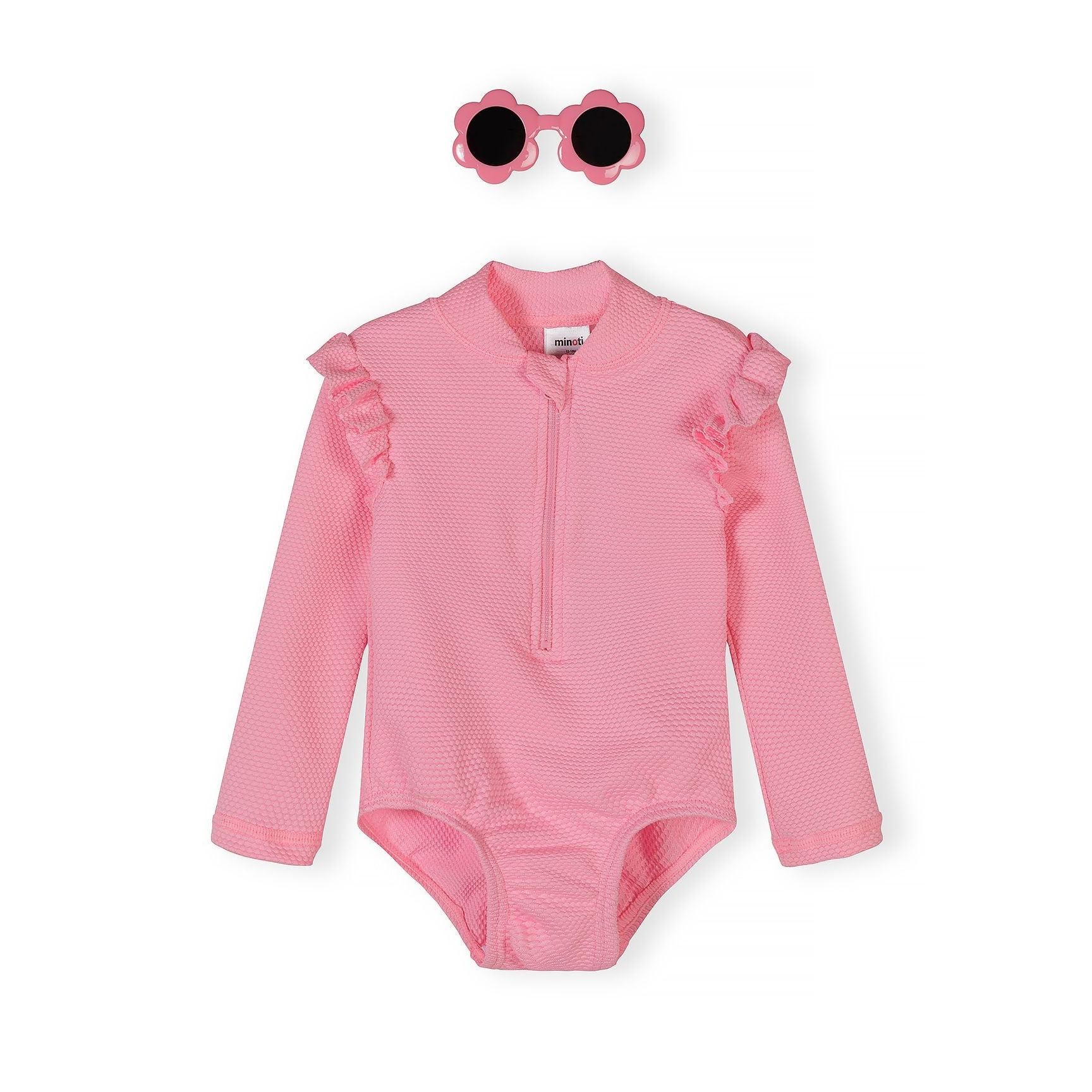 Light pink long sleeve swimsuit with quarter-zip front and ruffle shoulder details, displayed with matching floral sunglasses on white background