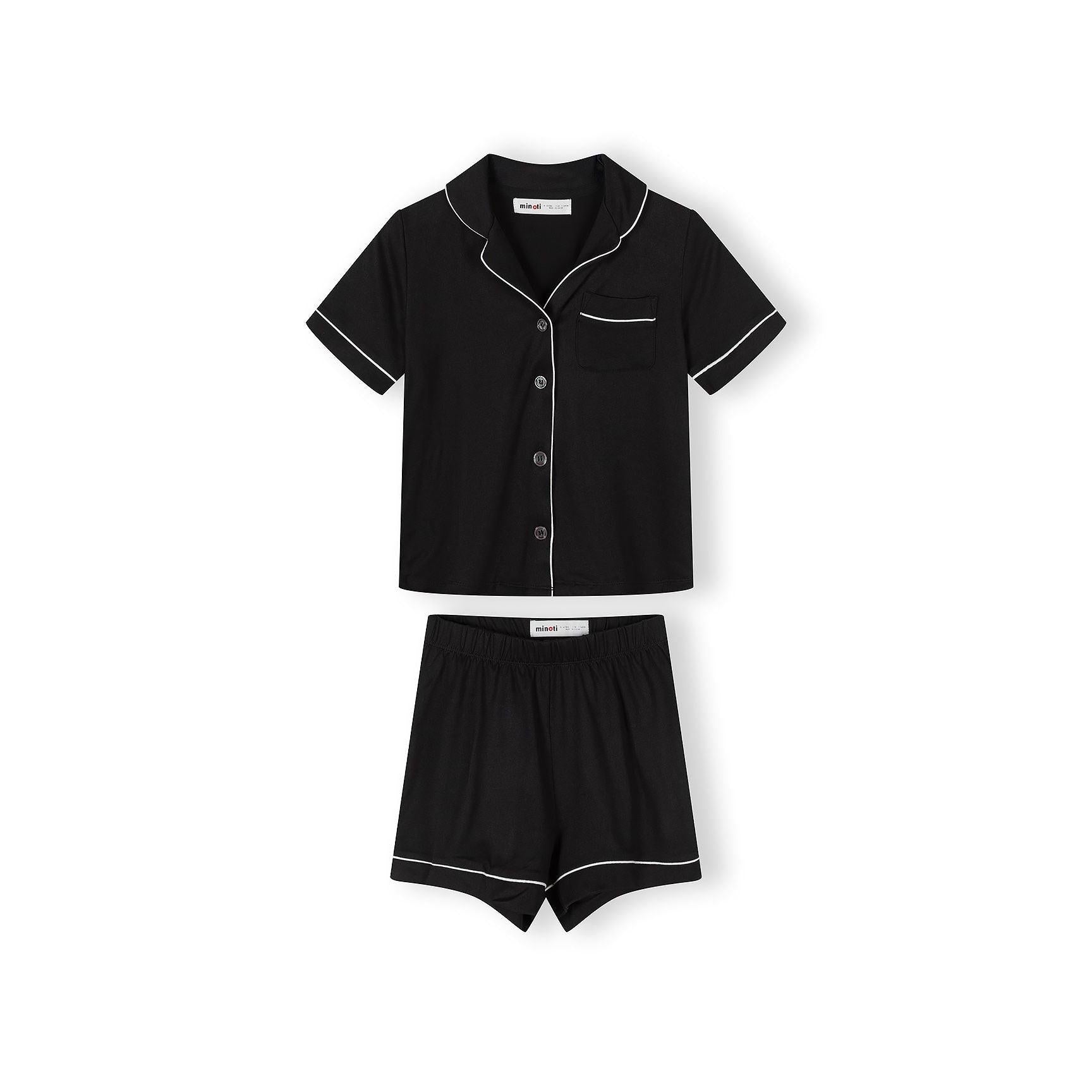 Close-up detail of pink pyjama top showing Minoti label, bow print pattern and button fastening