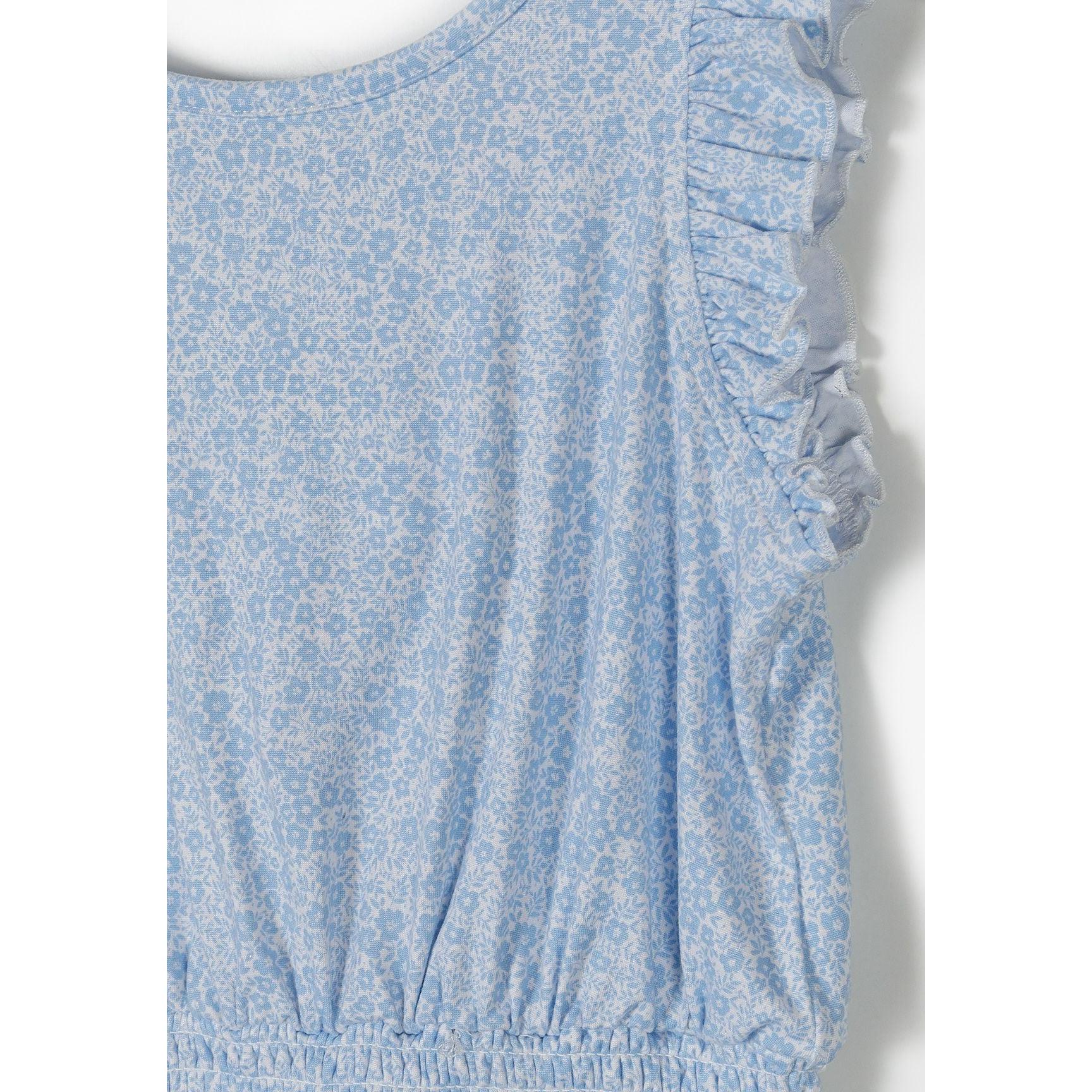 Close-up detail of blue floral jumpsuit showing ruffle sleeve trim and delicate floral print pattern on fabric