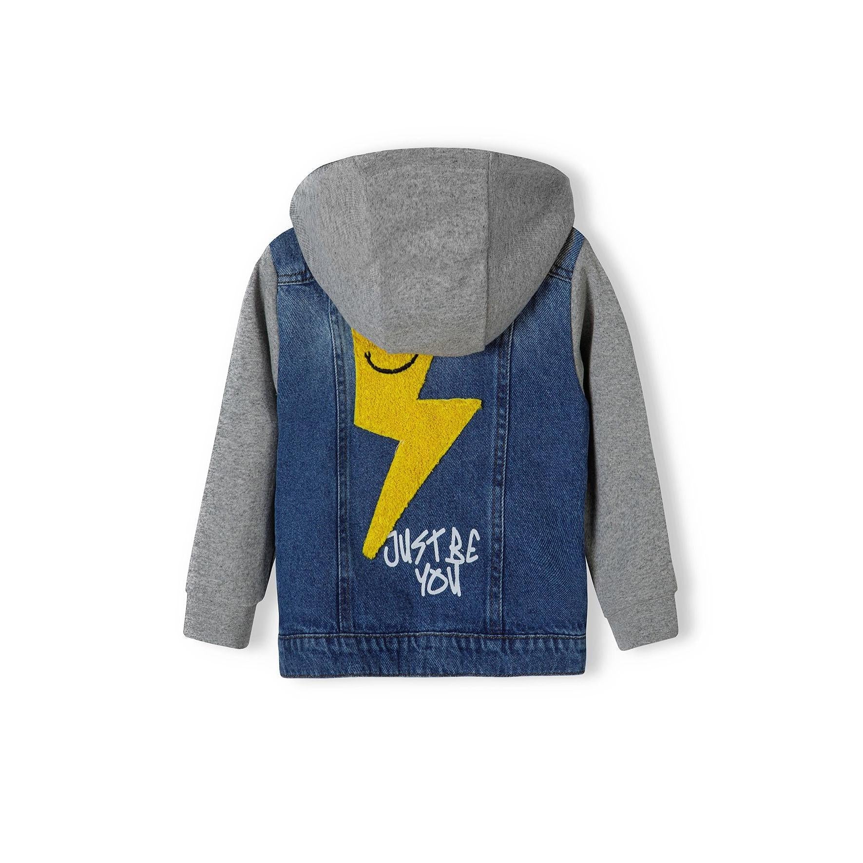 Back view of light blue denim jacket showing grey fleece hood with yellow lightning bolt design and 'JUST BE YOU' text printed on the denim back panel