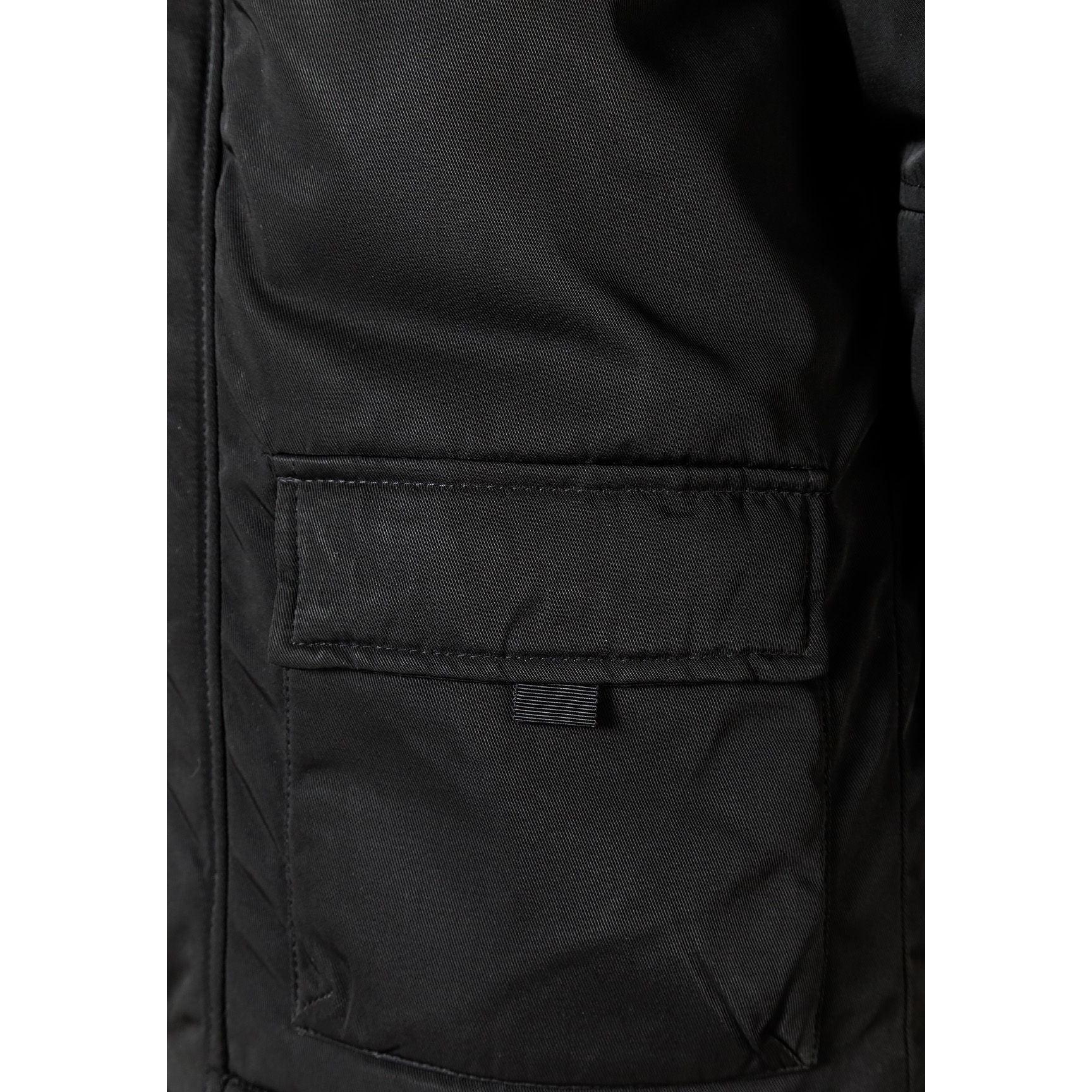 Close-up detail of black parka hood with grey faux fur trim showing attachment buttons and fabric texture