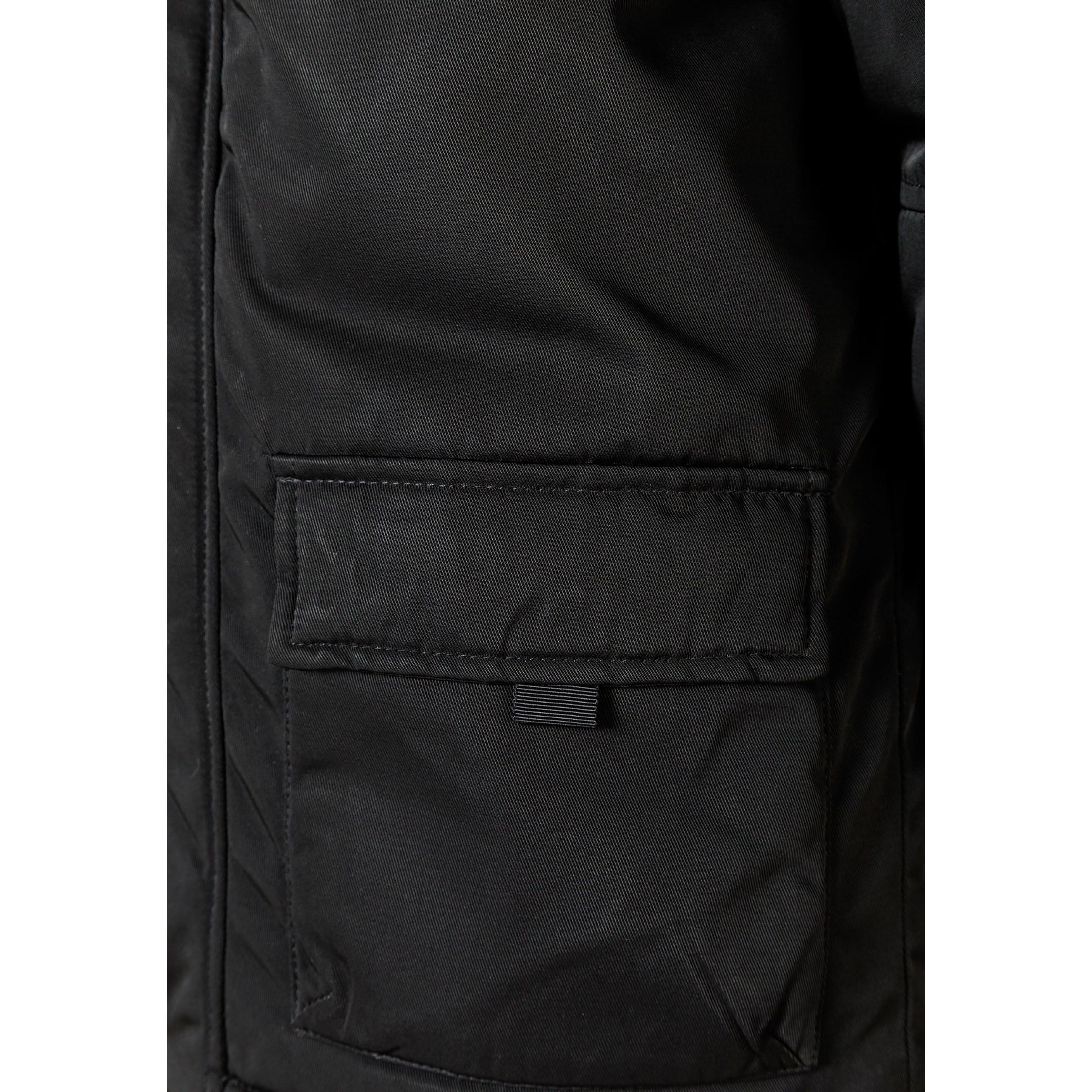 Close-up detail of black parka hood with grey faux fur trim showing attachment buttons and fabric texture