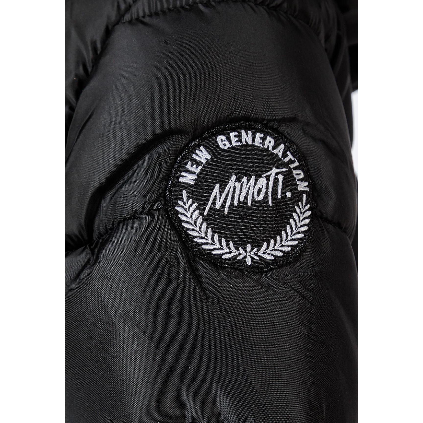 Close-up detail of faux fur hood trim and black fabric showing quilted pattern and zipper details