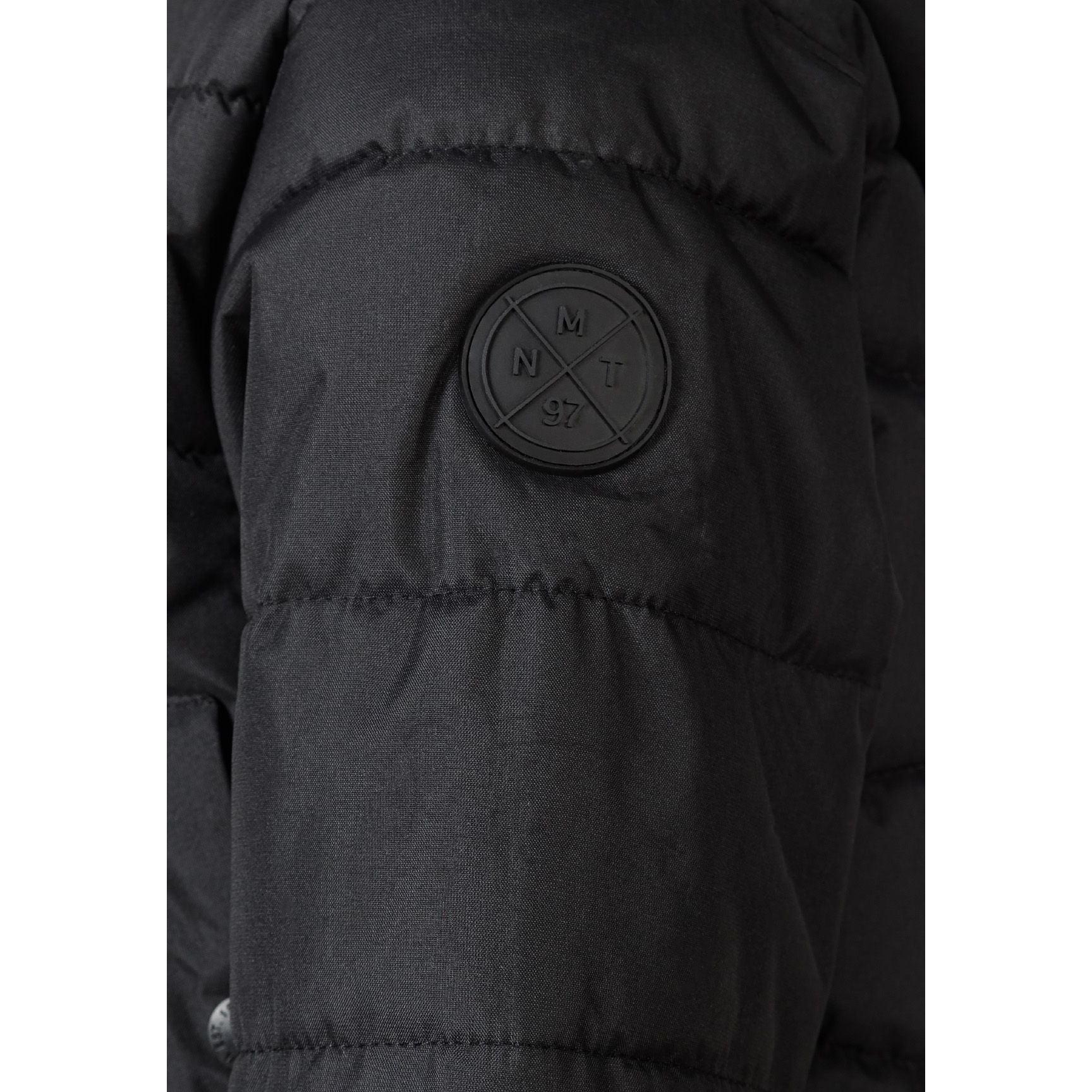 Close-up detail of black circular Minoti logo patch on the sleeve of the padded jacket showing MT 97 branding