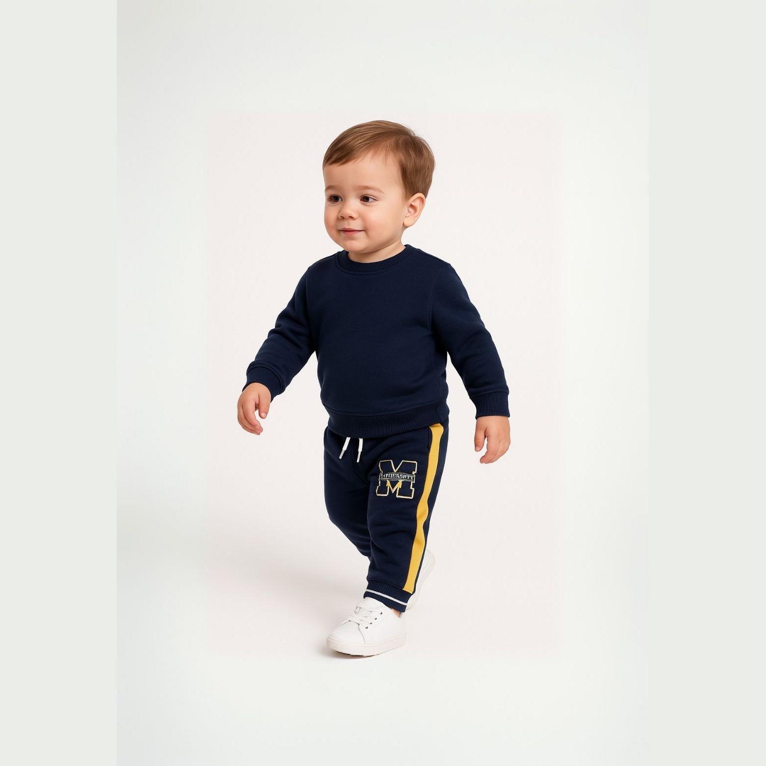 Toddler wearing navy fleece sweatpants with yellow side panels and matching navy sweatshirt, standing against white background, showing full outfit styling