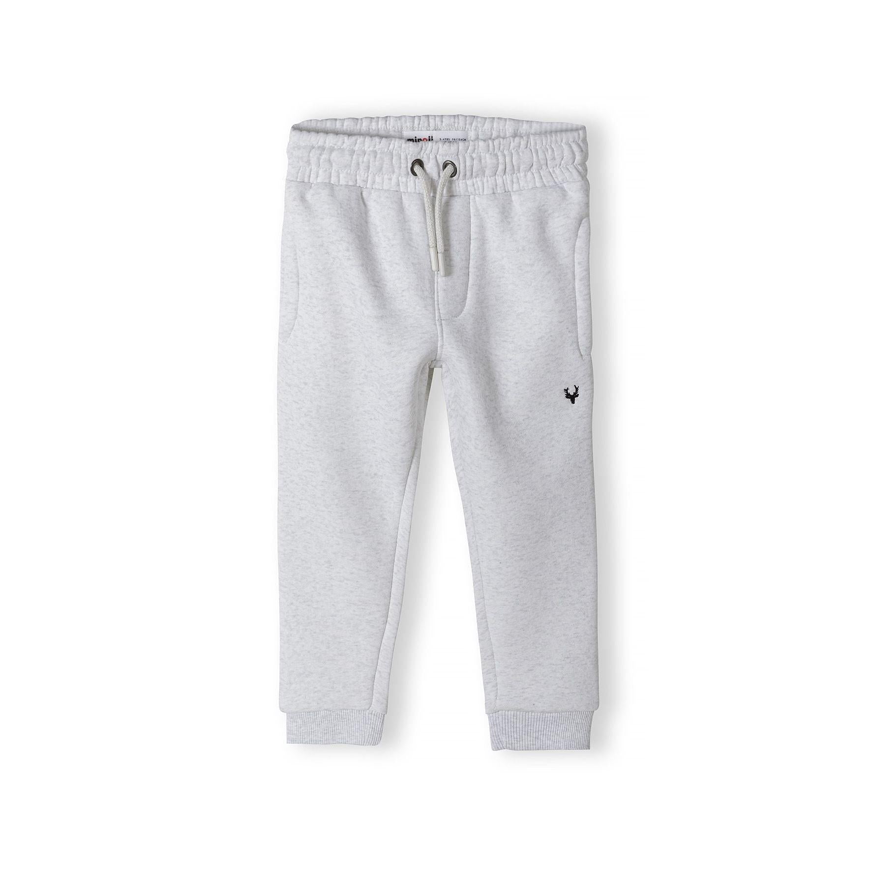 Grey joggers laid flat showing full length view with elasticated waistband and ribbed cuffs