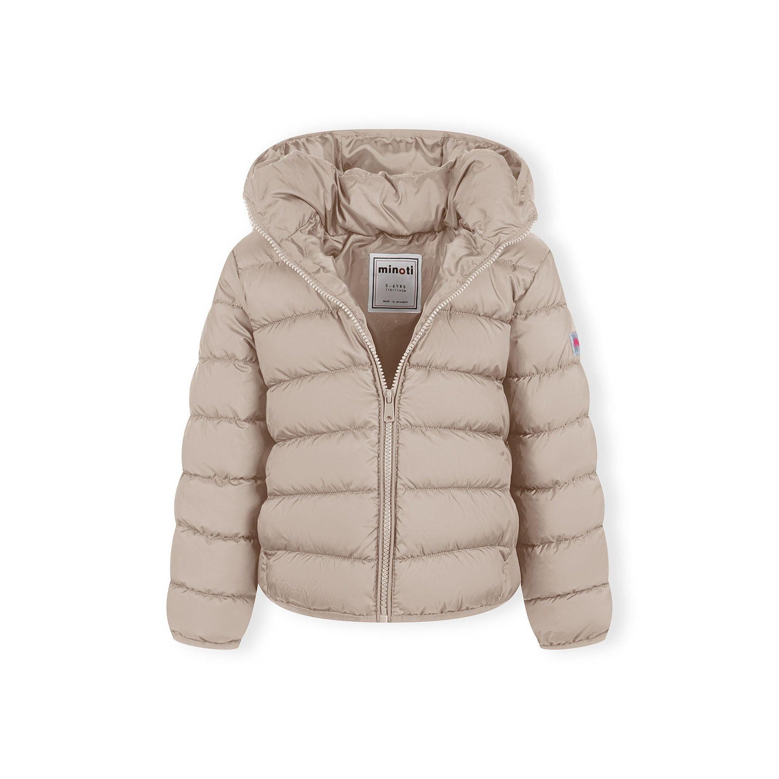 Detailed view of beige quilted jacket construction showing padded panels, zip mechanism and hood design elements, soft neutral lighting