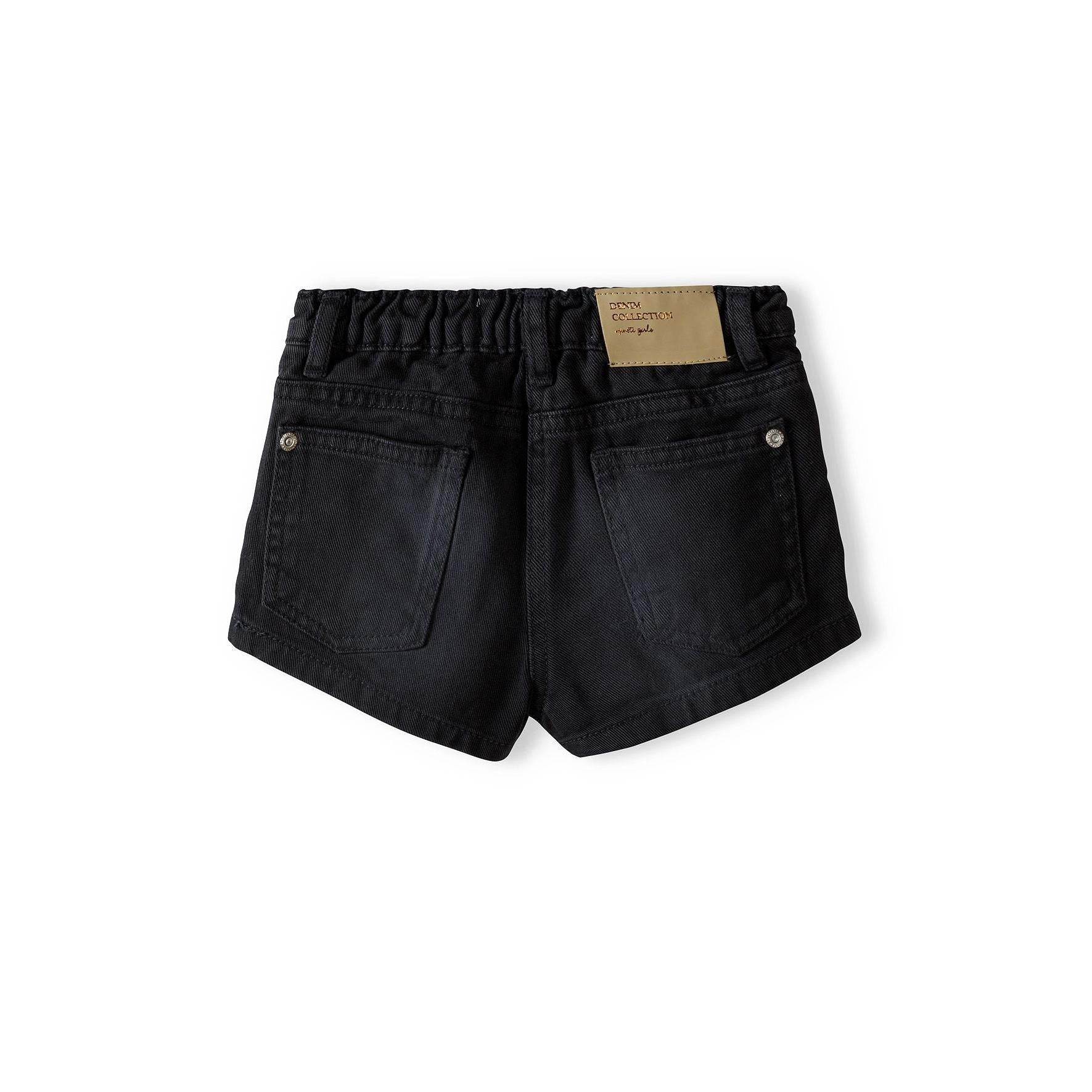 Back view of black acid wash denim shorts showing rear pockets, seam details and beige size label on white background