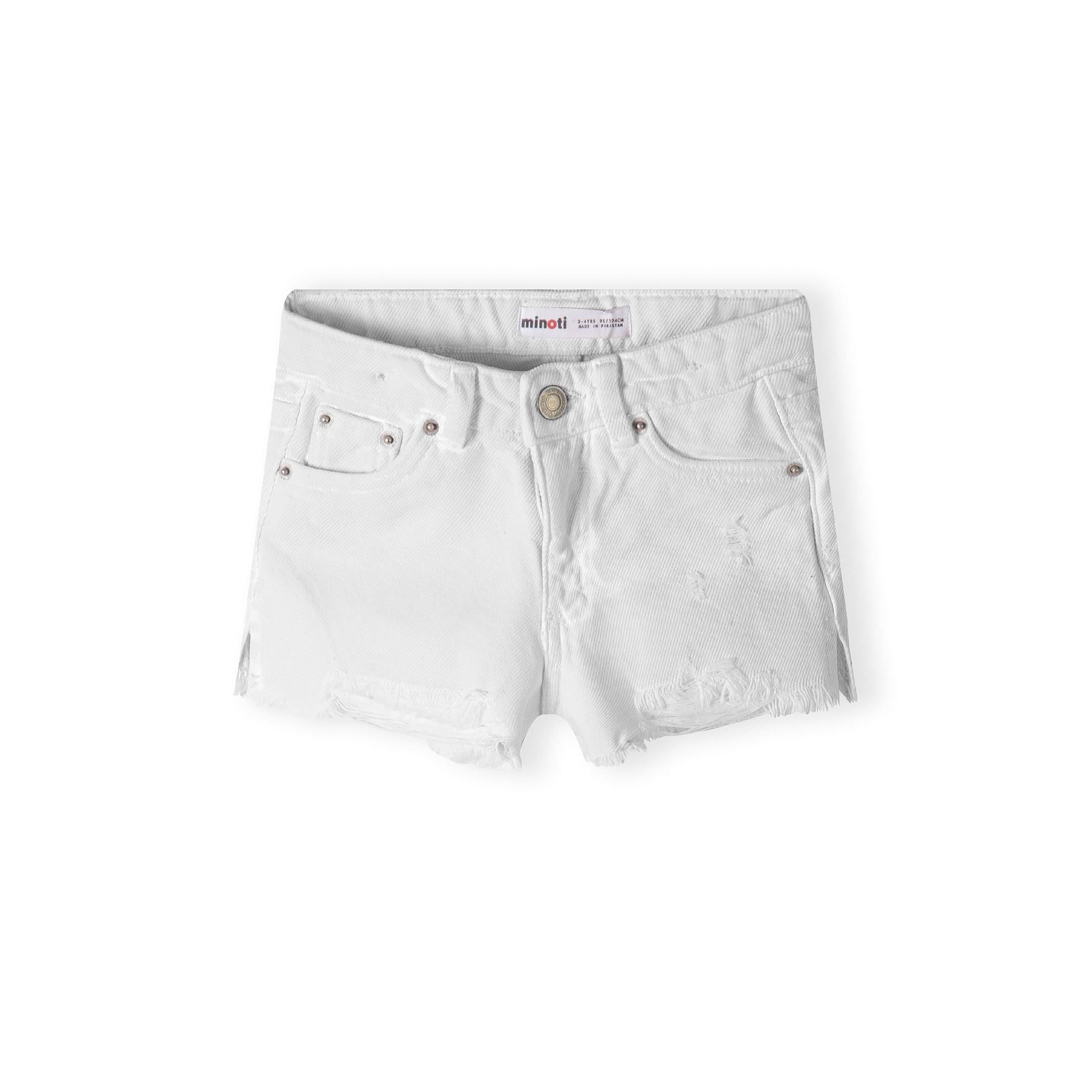 White denim shorts laid flat showing back view with pink Minoti label patch and frayed hem details