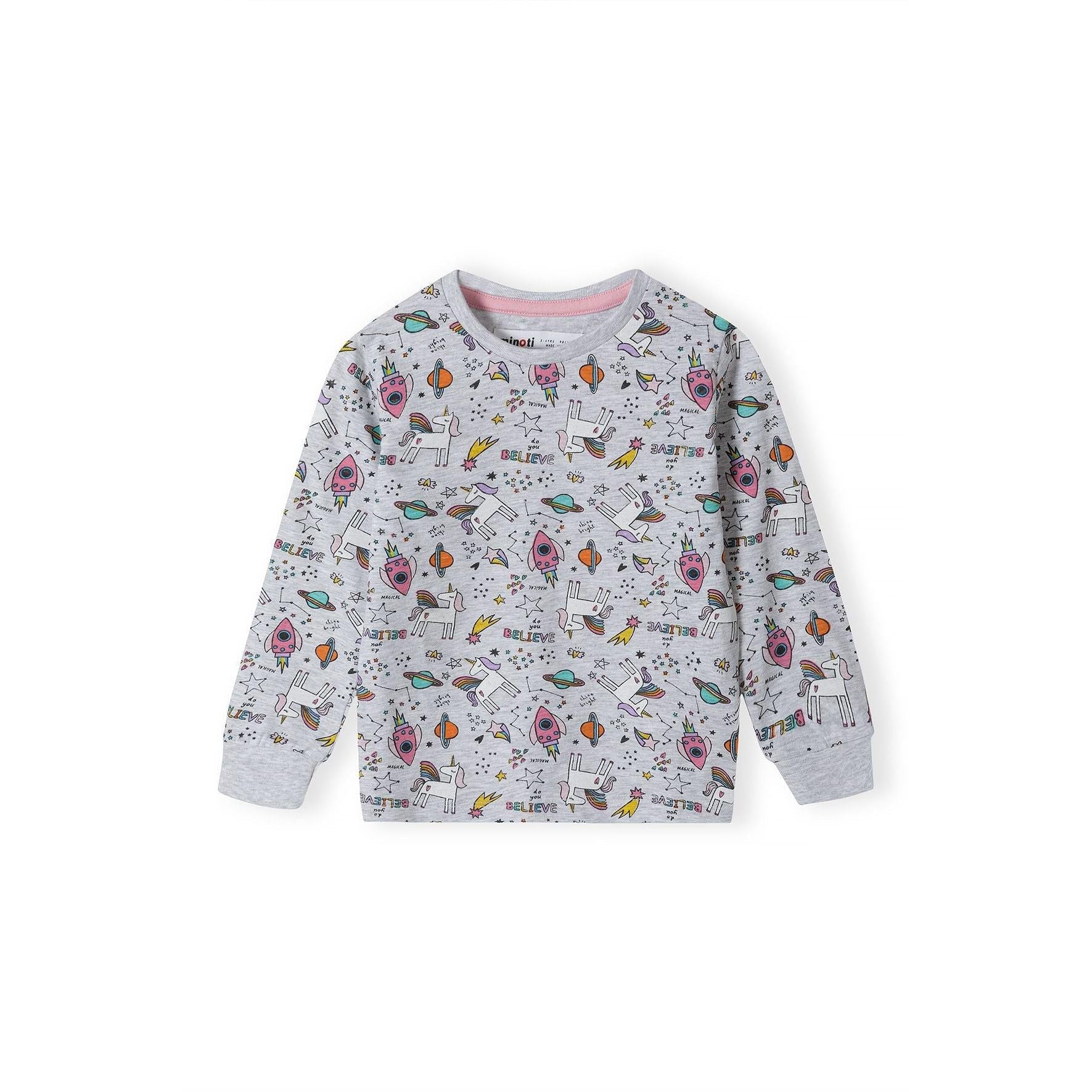 Close-up detail view of grey pyjama top showing colorful unicorn, rocket, planet and star print pattern with believe text and pink trim at neckline