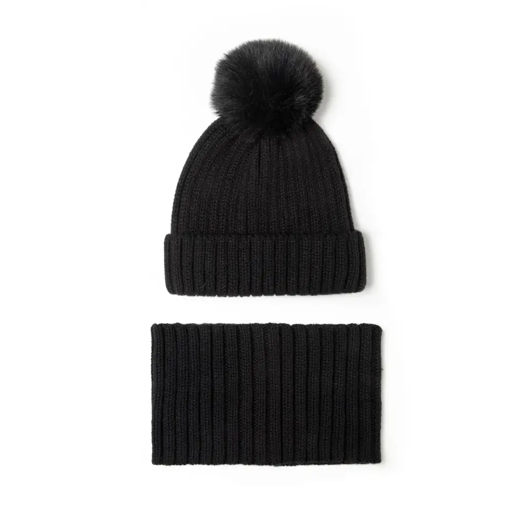 Close-up detail of black ribbed knit fabric texture showing the ribbed pattern and soft material construction