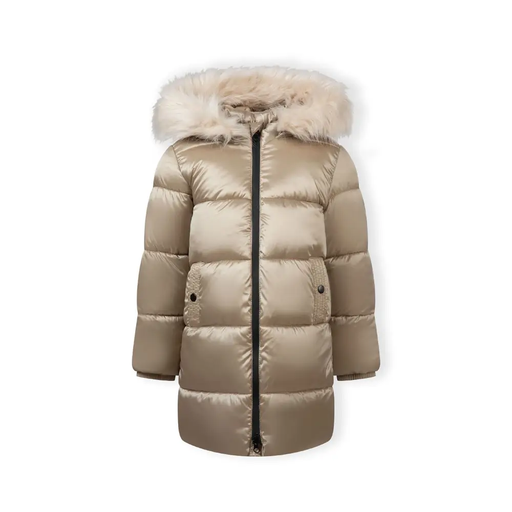 Same girl in gold quilted jacket walking pose, showing full length jacket design with hood up, dark wash jeans and white sneakers on white studio background