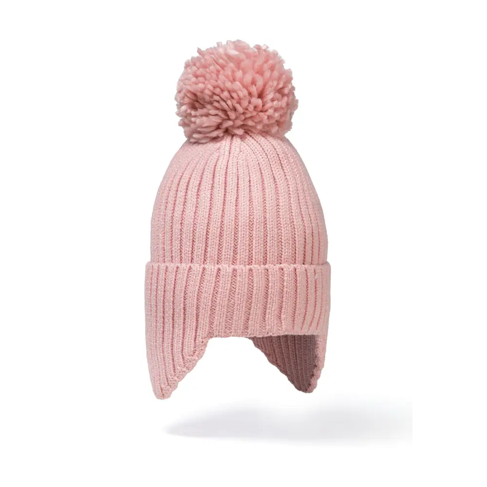Close-up view of cream white ribbed knit beanie with large fluffy white pom pom and ear flaps against white background